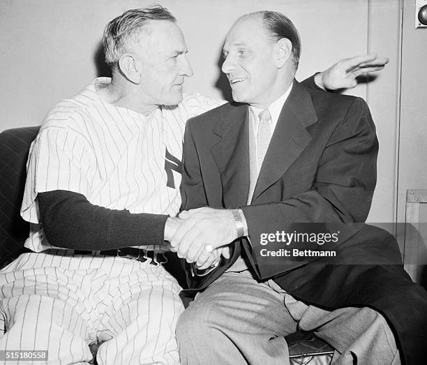 New York, NY: Manager Leo Durocher of the New York Giants, congratulates manager Casey Stengel of the New York Yankees, after the Yankees defeated...