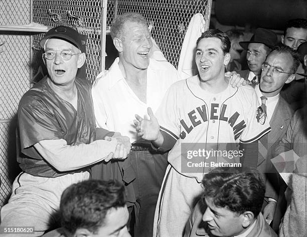 Boston, Mass: President Bill Veeck of the Cleveland Indians splits his face in a hearty guffaw as he congratulates Manager Lou Boudreau after his...