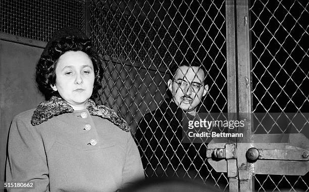 Ethel and Julius Rosenberg sitting in a police van after being convicted of espionage.