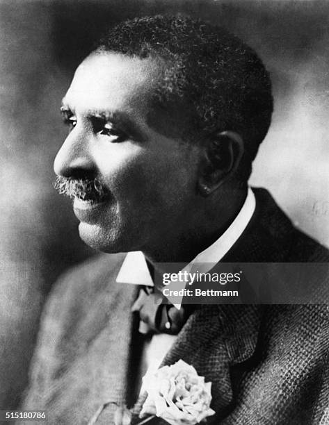 George Washington Carver with a rose in jacket lapel.