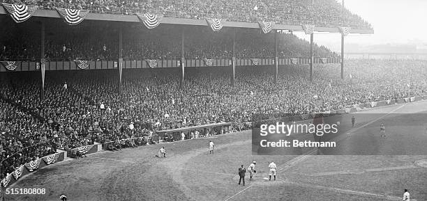 New York, NY: Original Caption. A view of the decked grandstand showing a portion of the 70,000 that witnessed the game.