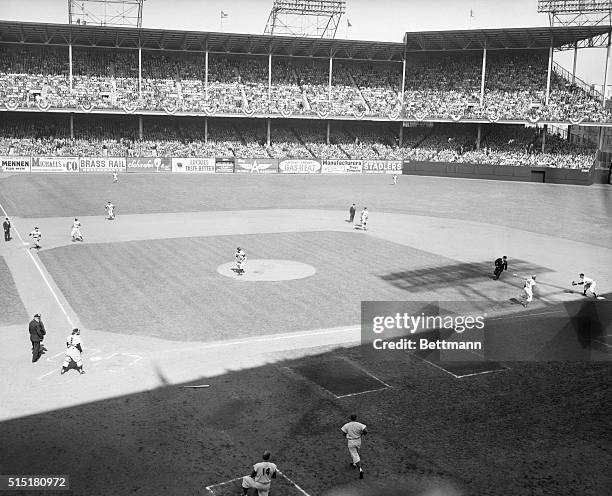 New York, NY: Here's a view of the diamond at Ebbets Field during the round-the-horn double play that broke up a Dodger threat in the first inning of...