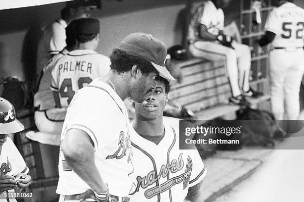 Atlanta, GA- Ken Griffey, Jr., , the nation's number one draft pick, who is headed to the Seattle Mariners, has a dugout chat wth his dad, Ken...