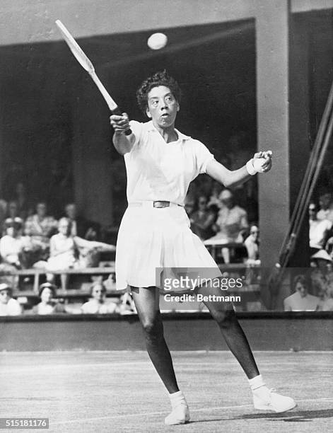 Wimbledon, England: Althea Gibson, playing for Woman's Tennis Title at Wimbledon. June 8, 1957.