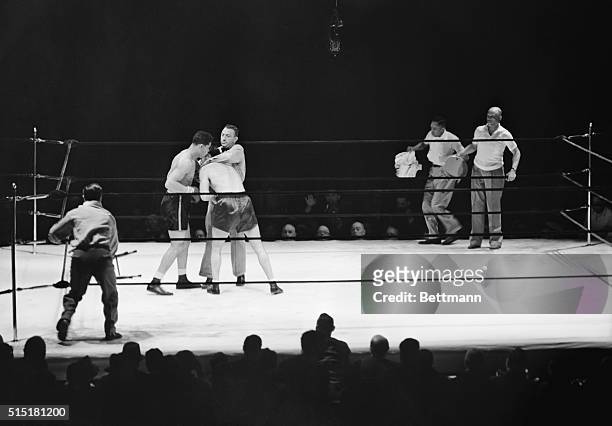 Yankee Stadium, NY- At the end of the fourth round of the Max Schmeling-Joe Louis fight, after Louis had been sent to the canvas by Schmeling's...