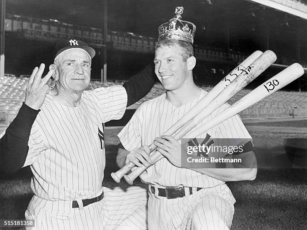 New York, NY - Yankee Manager Casey Stengel proudly presents the apple of his eye, his switch-hitting majesty Mickey Mantle, complete with crown and...