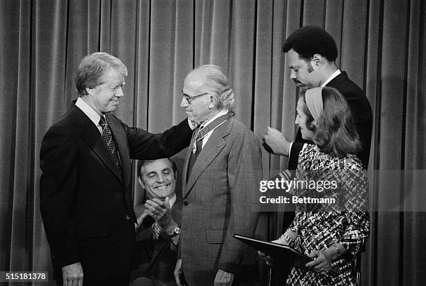 Washington, D.C.: President Carter congratulates Dr. Jonas Salk after presenting Salk with the Medal of Freedom 7/11. Salk was awarded the National...