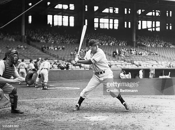Lou Boudreau, shortstop for the Pittsburgh Pirates, is shown in the beginning of a swing at the ball.
