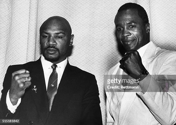 New York, NY- Middleweight champ Marvin Hagler and challenger Sugar Ray Leonard show their fists as they appear at a news conference. It was...