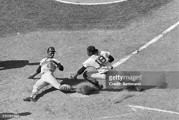Boston, MA- Baltimore Orioles' Paul Blair is safe at home plate, scoring from second base on a single hit by Frank Robinson to Bosox center fielder...