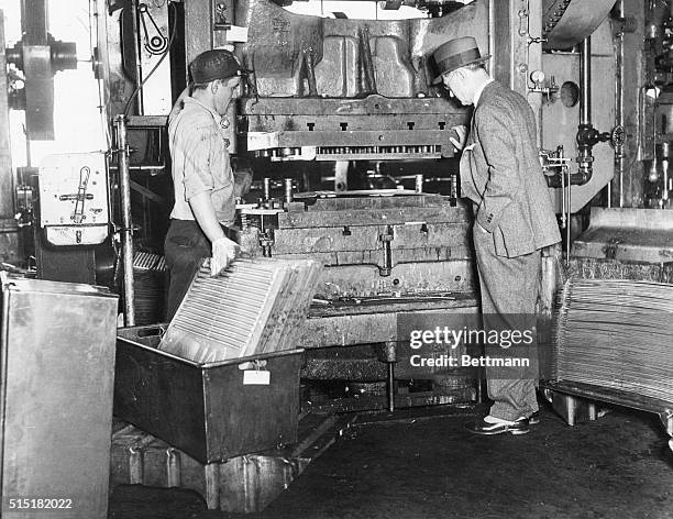 Mansfield, OH: C. E. Allen, Commercial Vice-President of the Westinghouse Electric and Manufacturing Company, is shown inspecting a punch press which...