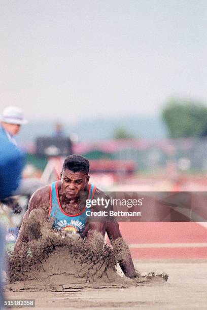 Seattle, WA- Carl Lewis touches down at 27'6" to win the gold medal in the long jump competition of the Goodwill Games. Lewis has a nine year winning...