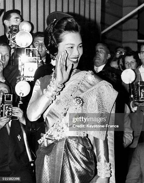 Queen Sirikit Kitiyakara Of Thailand waves at the crowd when arriving at the Thai embassy at Ashburn Place in London, United Kingdom for a dinner...