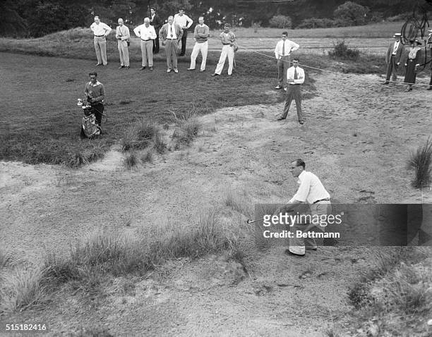 Pine Valley, NJ- H. G. Bentley of the British team shoots out of a sand trap on the fifth hole during his singles match in the Walker Cup Tournament.