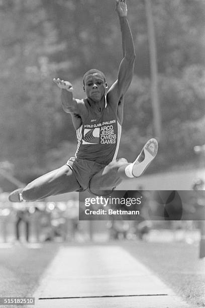 Los Angeles, CA- Carl Lewis sails through the air as he jumps 27-10 1/4 in the men's long jump of the ARCO Jesse Owens Games' "World Class Challenge."