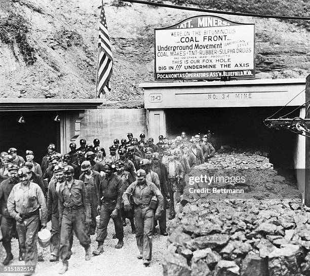 Bishop, WV- Bituminous coal miners inspired by overseas victories of their sons & brothers, put this sign over mine entrance exhorting themselves to...