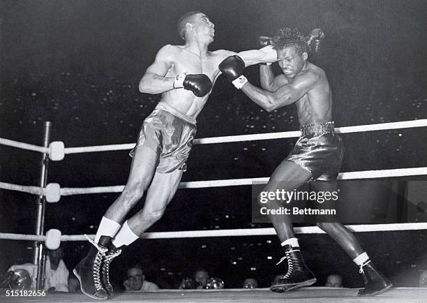 London, England- Randolph Turpin, of Britain, last night beat Sugar Ray Robinson, the holder of the world middleweight title, at Earl's Court. Turpin...