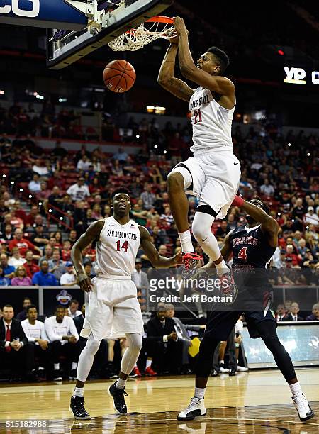 Malik Pope of the San Diego State Aztecs dunks against Karachi Edo of the Fresno State Bulldogs during the championship game of the Mountain West...