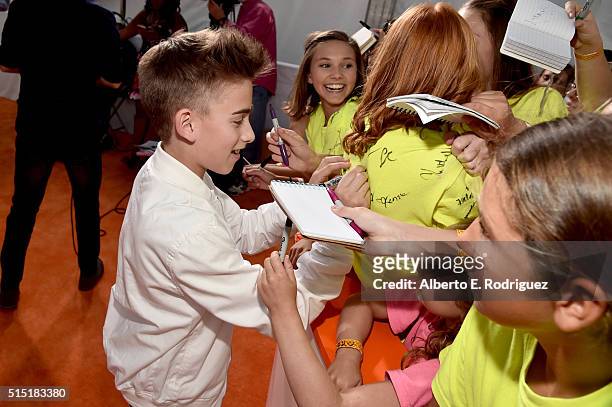Singer Johnny Orlando signs autographs at Nickelodeon's 2016 Kids' Choice Awards at The Forum on March 12, 2016 in Inglewood, California.