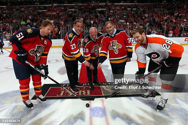 Scott Mellanby, Brain Skrudland, John VanBiesbrouck of the Florida Panthers participate in the ceremonial puck drop celebrating the Panthers 20 year...