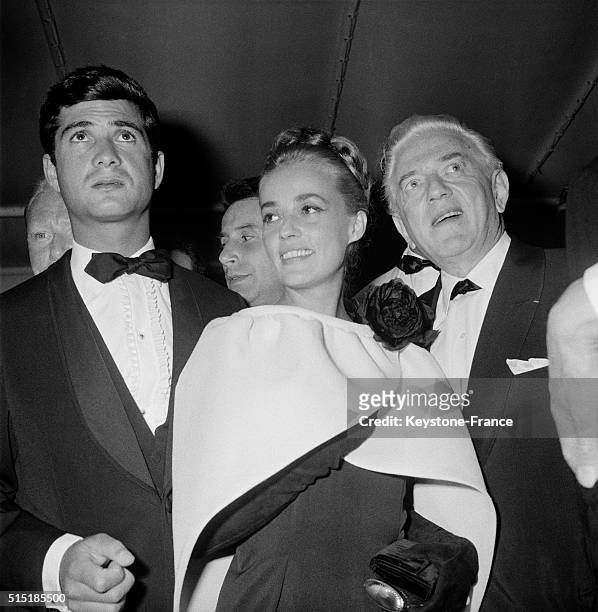 Actors Jean-Claude Brialy And Jeanne Moreau With Director Anatole Litvak At the Cannes Film Festival, in Cannes, France, on May 11, 1962.