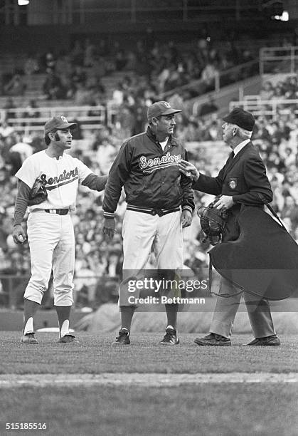 Washington, D.C.- Washington manager Ted Williams argues over a fair ball call by plate umpire Red Flaherty during second game of a doubleheader...