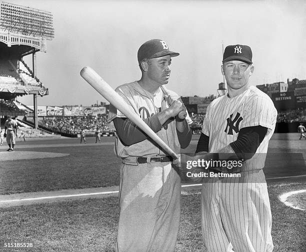 Duke Snider and Mickey Mantle pose together before the star of teh second World Series game.