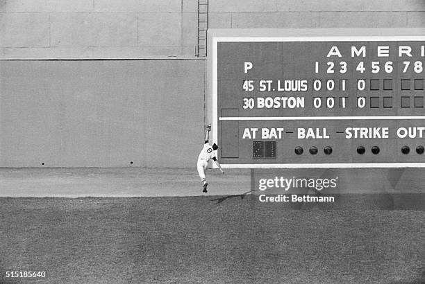 Boston, MA- Carl Yastrzemski of the Boston Red Sox makes a spectular catch of Curt Flood's line drive for the first out of the St. Louis Cardinals'...