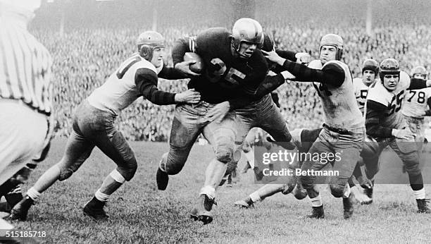 November 17, 1946-Philadelphia, Pennsylvania: Penn tacklers reach for Doc Blanchard, Army fullback, after he ripped the line for a short gain the...