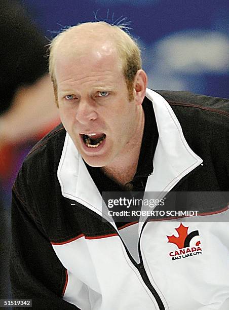 Canadian curly skip Kevin Martin directs his teammates in their match against Denmark during the men's curling event 18 February 2002 at the Salt...