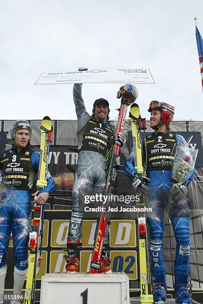 Erik Schlopy, Thomas Vonn and Jake Zamansky of the USA celebrate on the podium after the men's giant slalom at the Gold Cup in Park City, Utah....