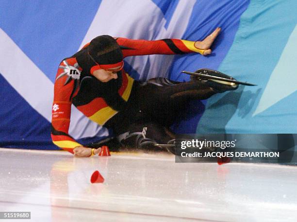 German Christian Breuer crushes into the bareer in the men's 1500m speed skating race at the Utah Olympic Oval, 19 February 2002 during the XIXth...