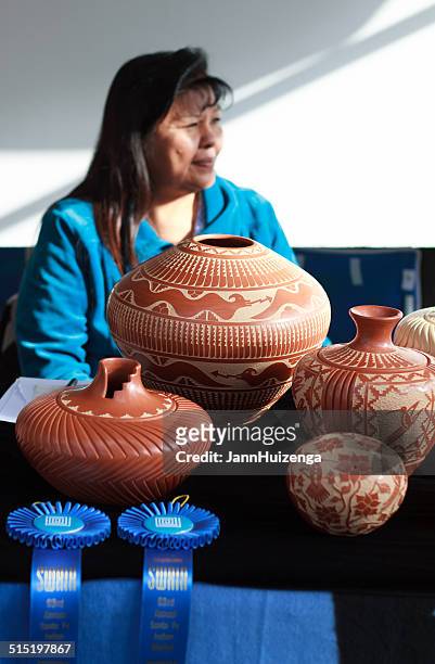 jemez pueblo potter at 2014 santa fe indian market - puebloan culture stock pictures, royalty-free photos & images