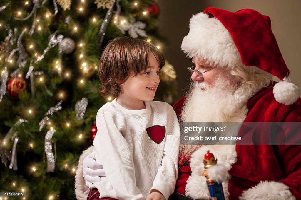 Young Boy in Awe Sits on Santa's Lap