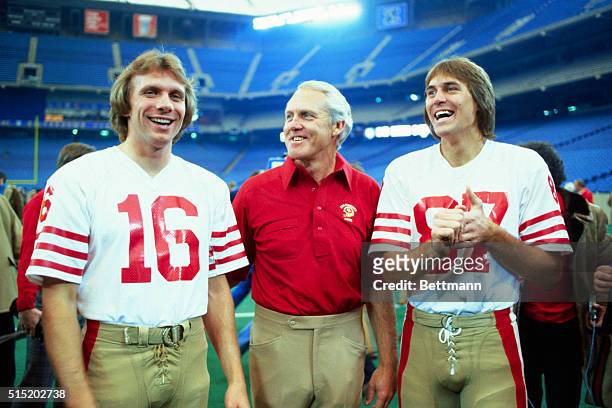 Pontiac, Mich.: Coach Bill Walsh of San Francisco Forty-Niners with quarterback Joe Montana and wide receiver Dwight Clark at the superbowl.