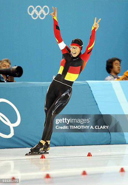 German world record holder Anni Friesinger jubilates after breaking her own world record in 1.54.02 in the women's 1500m speed skating race at the...