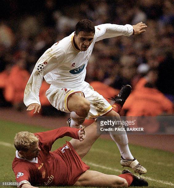 Galatasaray 's Goktan berkant vaults over Liverpool 's Stephane Henchoz during today 's EUFA Champions League clash at Anfield, in Liverpool 20...