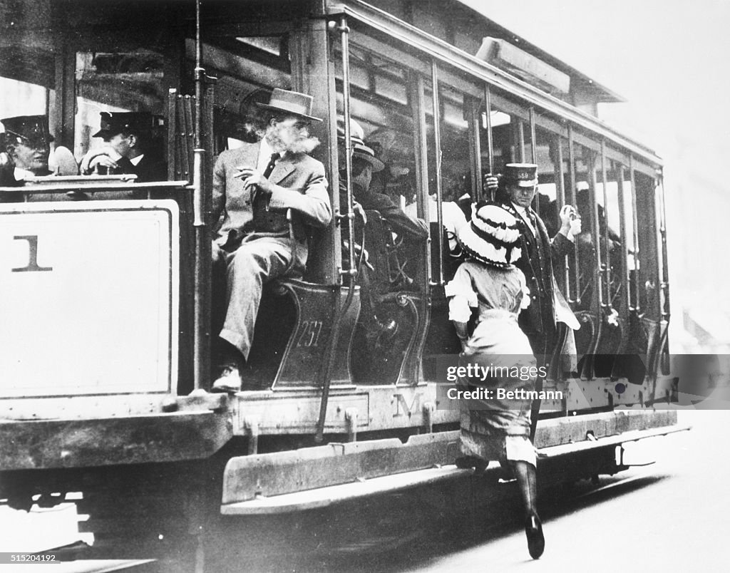 Man Watching Woman Boarding New York Trolley Car