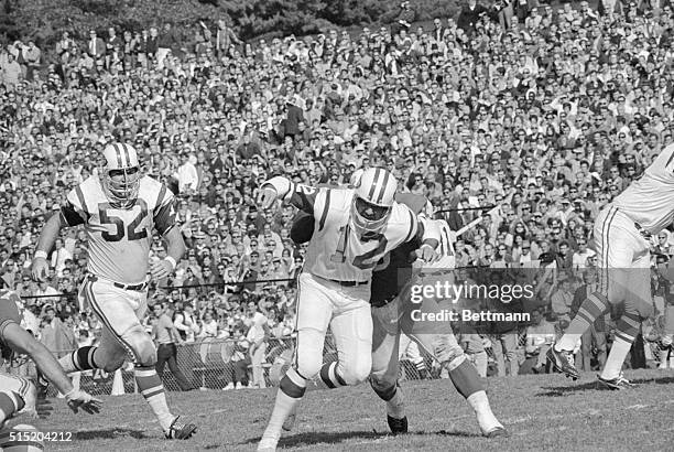 Boston, Massachusetts- New York Jets' quarterback Joe Namath gets the ball away before being hit by Boston Patriots' Houston Antwine during the 2nd...