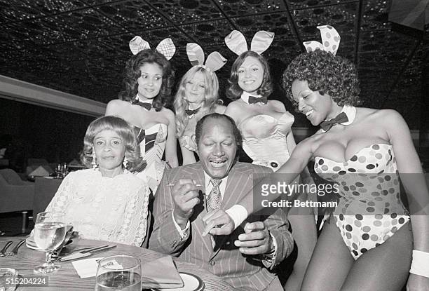 Century City, CA-Mayor Thomas Bradley of Los Angeles is shown autographing the cuff of Bunny Gloria at the gala opening of the Playboy Club August...