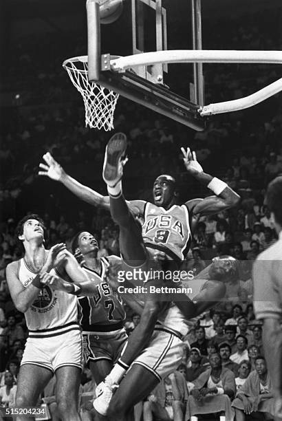 Milwaukee, Wisconsin- Michael Jordan USA Olympic team fell into NBA All-Star Mickey Johnson after going to the basket during the first half of the...