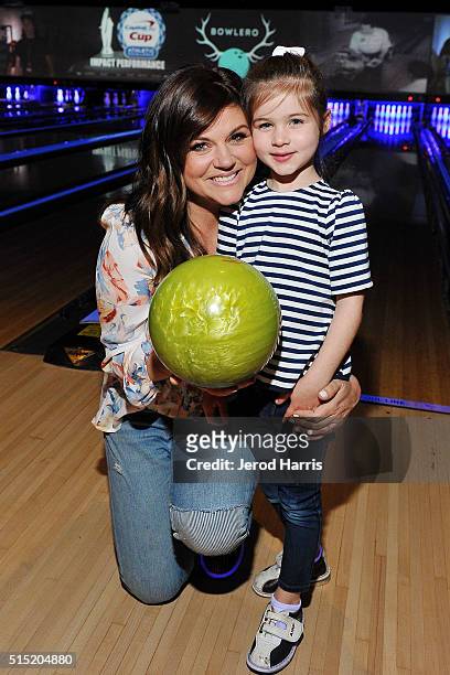 Actress Tiffani Thiessen and daughter Harper attend the Grand Opening of Bowlero on March 12, 2016 in Woodland Hills, California.