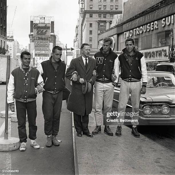 Dr. Walter Hendricks , president of Windham College in Putney, Vermont, stands between the four Windham students who arrived in Times Square after a...