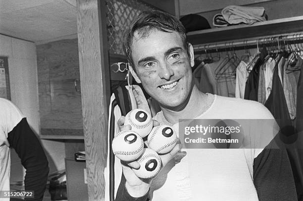 Nolan Ryan proudly displays baseballs in his right hand after the no-hitter game he pitched earlier today. This is the fourth no-hitter game he has...