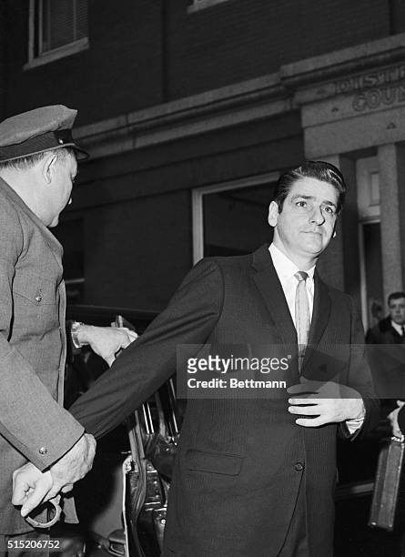 Albert De Salvo, who claims to be the Boston Strangler, is escorted into Cambridge Superior Court where will stand trial on charges of armed robbery,...