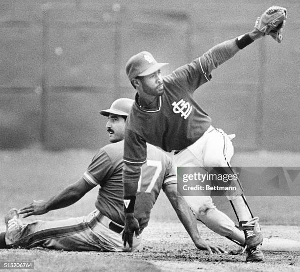 St. Petersburg, FL- St. Louis Cardinals Ozzie Smith lets his teammates know that he made the tag on NY Mets Keith Hernandez after Hernandez tried to...
