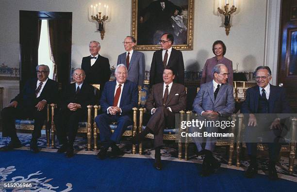 Washington, D.C.: United States President Ronald Reagan poses for a formal portrait with the judges of the United States Supreme Court. From left to...