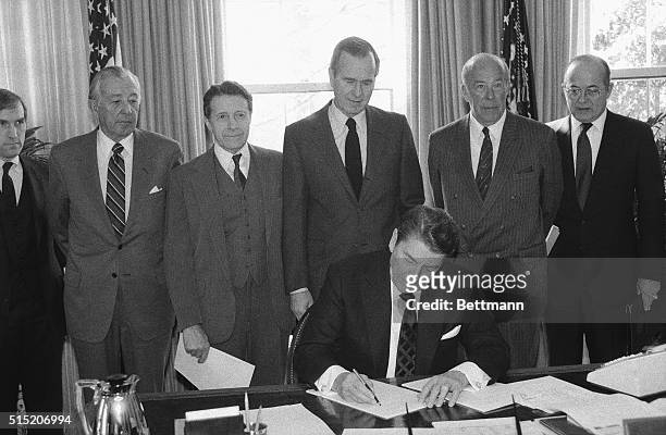 Washington, DC- President Reagan signs 2/25 a request to Congress asking for the transfer of funds in the Defense Department to be used for military...