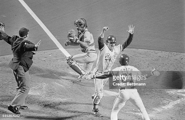 Kansas City: Royal's Jim Sundberg shouts as he scores the winning run in the ninth inning to tie the World Series, Card's catcher is Darrell Porter....