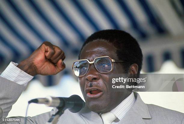Portrait of Robert Mugabe, Prime Minister of Zimbabwe, speaking at microphone.